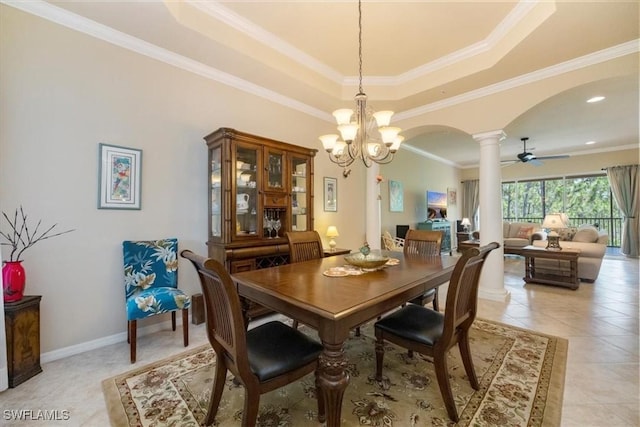 21726 Baccarat Ln Unit 201, Estero, FL 33928 - dining space featuring decorative columns, arched walkways, a raised ceiling, light tile patterned floors, and a chandelier