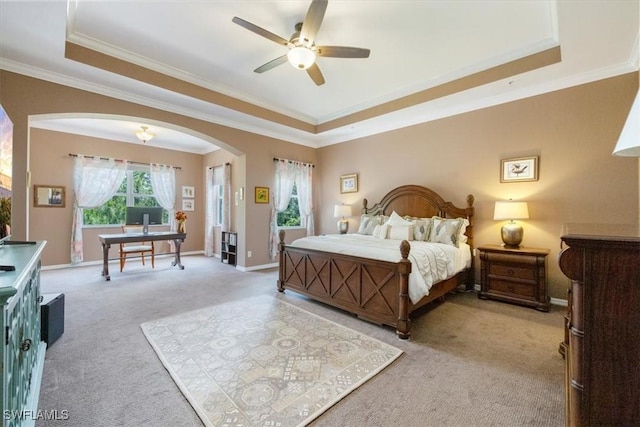 21726 Baccarat Ln Unit 201, Estero, FL 33928 - bedroom with a raised ceiling, arched walkways, light colored carpet, ornamental molding, and a desk