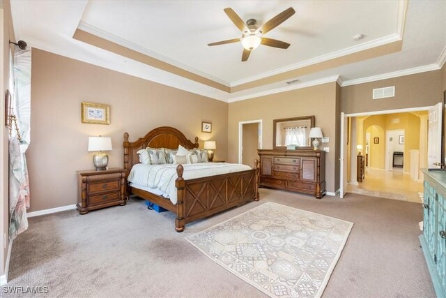 21726 Baccarat Ln Unit 201, Estero, FL 33928 - carpeted bedroom with a raised ceiling, arched walkways, ornamental molding, baseboards, and a ceiling fan
