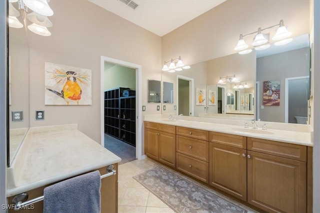 21726 Baccarat Ln Unit 201, Estero, FL 33928 - bathroom featuring double vanity and tile patterned floors