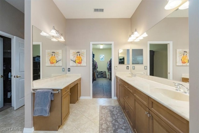21726 Baccarat Ln Unit 201, Estero, FL 33928 - full bathroom featuring double vanity, tile patterned floors, a walk in closet, and baseboards