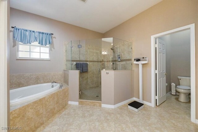 21726 Baccarat Ln Unit 201, Estero, FL 33928 - full bathroom with a garden tub, toilet, a stall shower, and tile patterned flooring