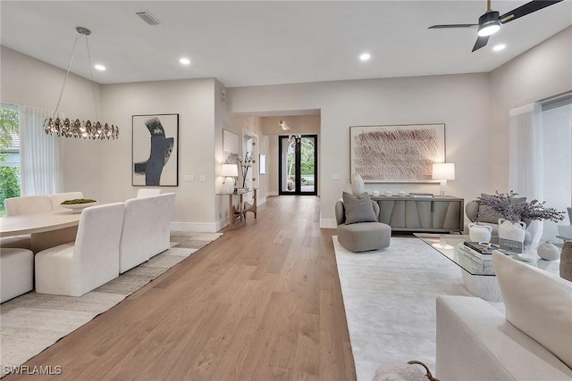 917 Tierra Lago Way, Naples, FL 34119 - living room featuring light wood-style flooring, healthy amount of natural light, ceiling fan, baseboards, and recessed lighting
