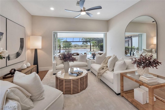 917 Tierra Lago Way, Naples, FL 34119 - living area featuring ceiling fan, a water view, recessed lighting, and baseboards