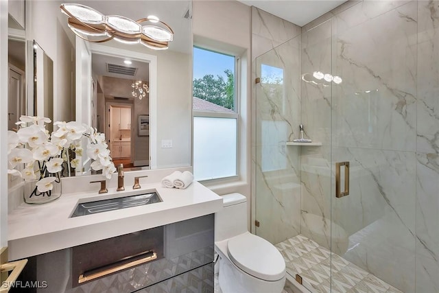 917 Tierra Lago Way, Naples, FL 34119 - full bath with a marble finish shower, vanity, and toilet