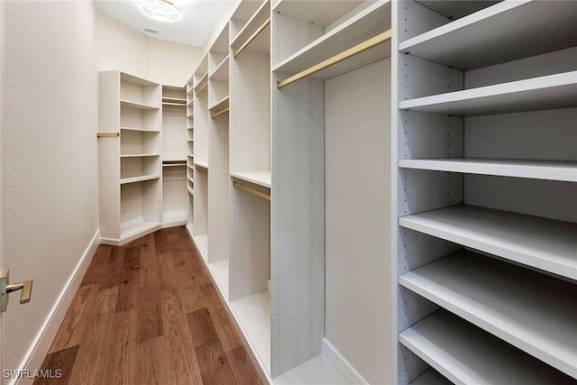 917 Tierra Lago Way, Naples, FL 34119 - walk in closet featuring wood finished floors