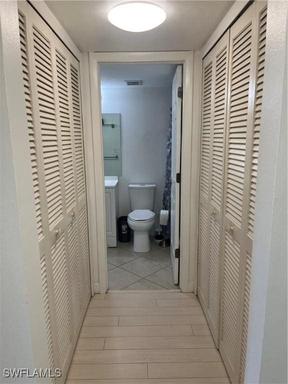 1740 Pine Valley Dr Unit 205, Fort Myers, FL 33907 - bathroom with a closet, toilet, and wood finished floors