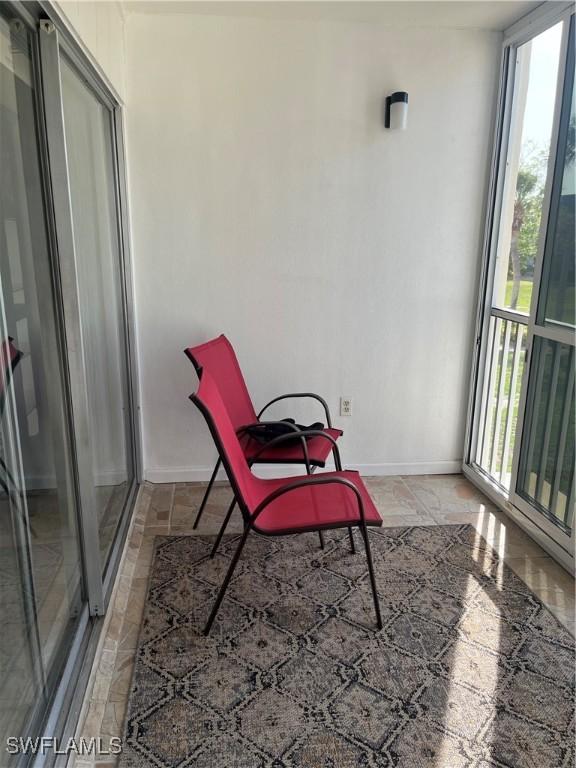 1740 Pine Valley Dr Unit 205, Fort Myers, FL 33907 - sunroom featuring plenty of natural light