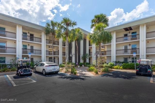 1740 Pine Valley Dr Unit 205, Fort Myers, FL 33907 - view of apartment building / complex with uncovered parking
