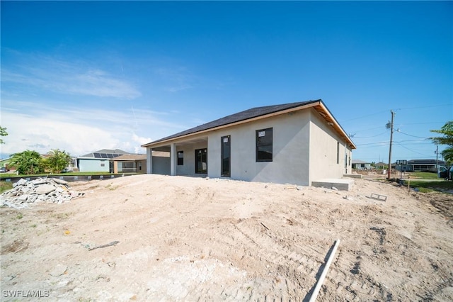 315 NW 10th St, Cape Coral, FL 33993 - back of property with stucco siding