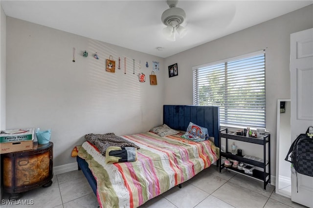 4520 Douglas Ln, Lehigh Acres, FL 33973 - tiled bedroom featuring a ceiling fan and baseboards