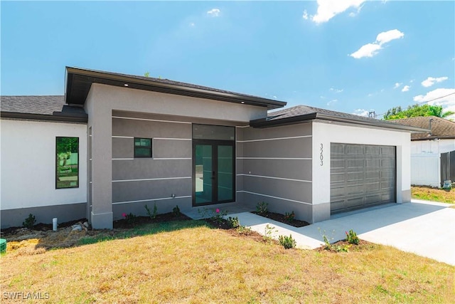 3203 18th St W, Lehigh Acres, FL 33971 - view of front facade with a garage, a front yard, concrete driveway, and stucco siding