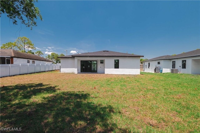 3203 18th St W, Lehigh Acres, FL 33971 - back of property featuring stucco siding and central AC unit
