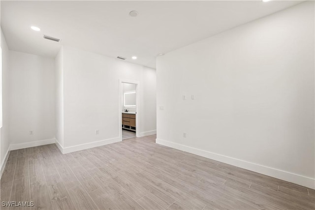 3203 18th St W, Lehigh Acres, FL 33971 - empty room featuring light wood-style floors, baseboards, and recessed lighting