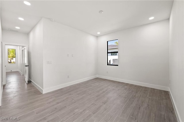 3203 18th St W, Lehigh Acres, FL 33971 - unfurnished room featuring baseboards, light wood finished floors, recessed lighting, and a smoke detector