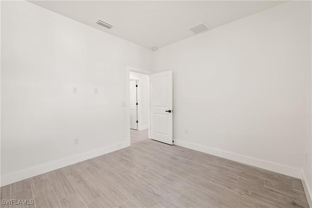 3203 18th St W, Lehigh Acres, FL 33971 - empty room featuring light wood-type flooring and baseboards