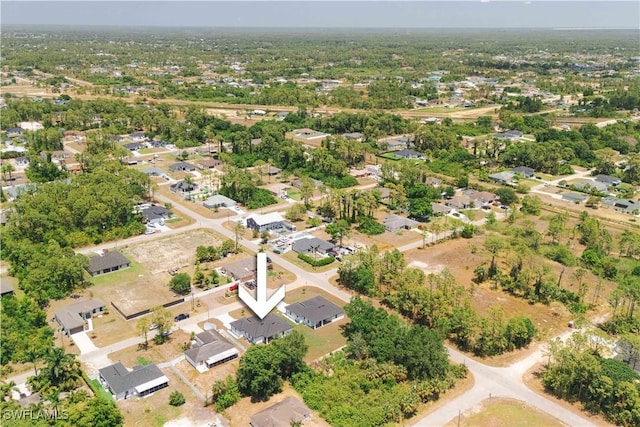 3203 18th St W, Lehigh Acres, FL 33971 - aerial view of property and surrounding area with nearby suburban area
