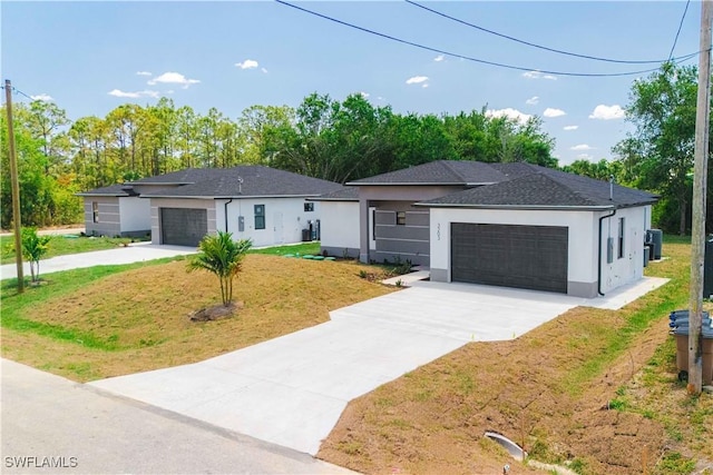 3203 18th St W, Lehigh Acres, FL 33971 - view of front of home featuring driveway, stucco siding, a front yard, and an attached garage