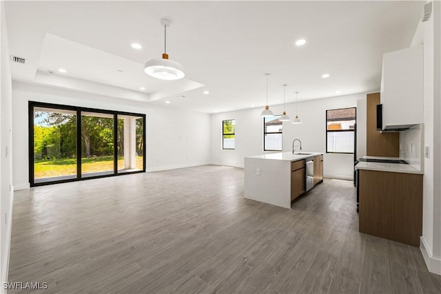 3203 18th St W, Lehigh Acres, FL 33971 - kitchen featuring open floor plan, dishwasher, light countertops, recessed lighting, and decorative light fixtures
