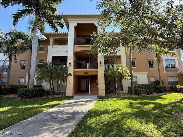 3947 Del Sol Ln Unit 203, Cape Coral, FL 33909 - view of property featuring driveway