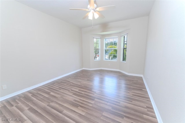 8331 Bernwood Cove Loop W Unit 1402, Fort Myers, FL 33966 - unfurnished room featuring wood finished floors, a ceiling fan, and baseboards