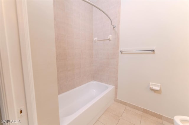 8331 Bernwood Cove Loop W Unit 1402, Fort Myers, FL 33966 - full bathroom with tile patterned flooring, toilet, baseboards, and bathing tub / shower combination
