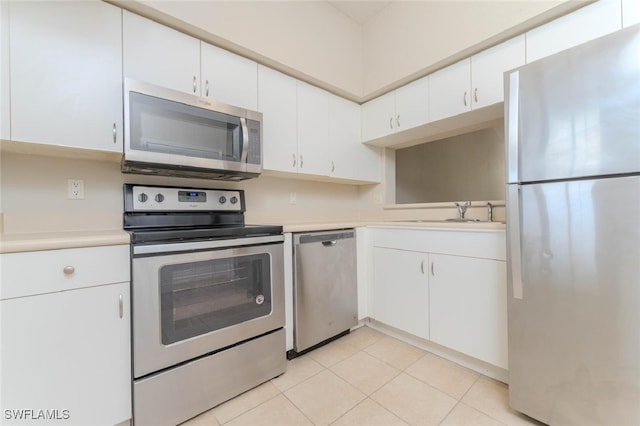 8331 Bernwood Cove Loop W Unit 1402, Fort Myers, FL 33966 - kitchen featuring appliances with stainless steel finishes, a sink, light countertops, and white cabinetry
