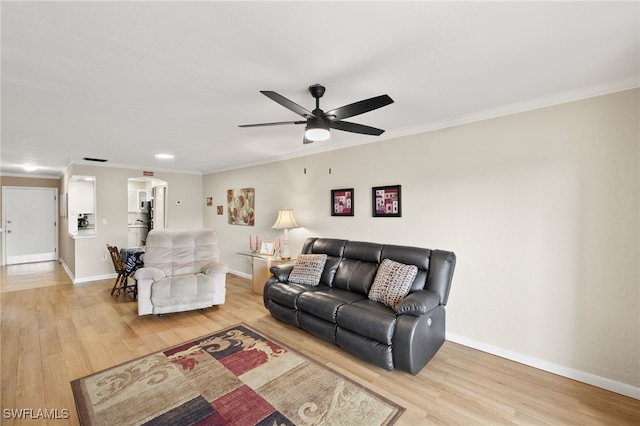 909 SE 46th Ln Unit 104, Cape Coral, FL 33904 - living room with ceiling fan, ornamental molding, light wood-type flooring, and baseboards