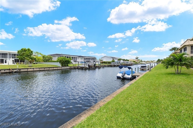 909 SE 46th Ln Unit 104, Cape Coral, FL 33904 - dock with a water view, a yard, and a residential view
