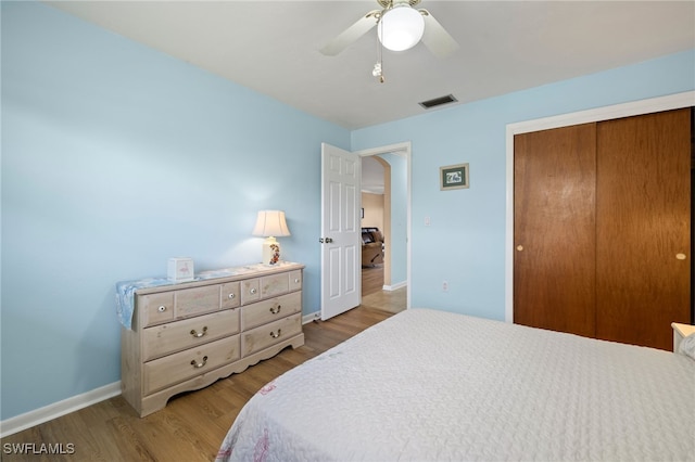 909 SE 46th Ln Unit 104, Cape Coral, FL 33904 - bedroom featuring baseboards, a closet, light wood-type flooring, and ceiling fan