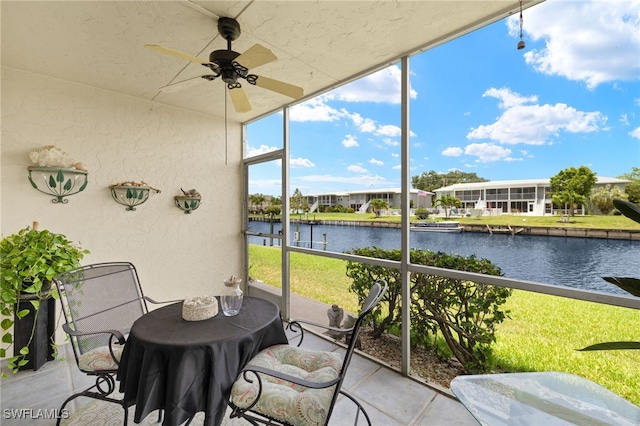 909 SE 46th Ln Unit 104, Cape Coral, FL 33904 - sunroom with a water view and a ceiling fan
