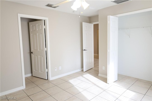 4526/4524 28th St SW, Lehigh Acres, FL 33973 - unfurnished bedroom featuring a closet, light tile patterned flooring, and a ceiling fan