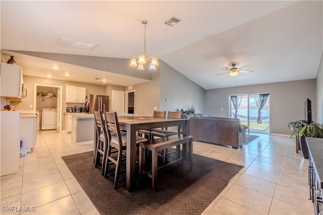 2220 NE 7th Ave, Cape Coral, FL 33909 - dining room with washer / clothes dryer, vaulted ceiling, light tile patterned flooring, a ceiling fan, and a chandelier