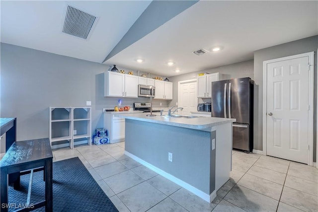 2220 NE 7th Ave, Cape Coral, FL 33909 - kitchen featuring appliances with stainless steel finishes, white cabinets, light countertops, light tile patterned flooring, and a sink