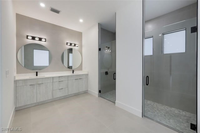 2806-2840 Golden Gate Blvd W, Naples, FL 34117 - bathroom with baseboards, double vanity, a shower stall, and recessed lighting