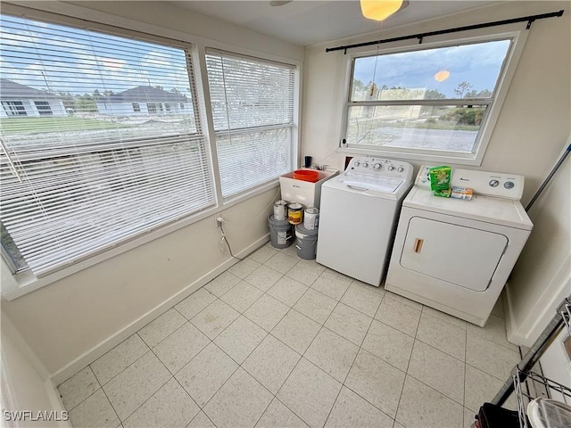 3700 26th St SW, Lehigh Acres, FL 33976 - laundry area with washing machine and clothes dryer, light tile patterned floors, and baseboards