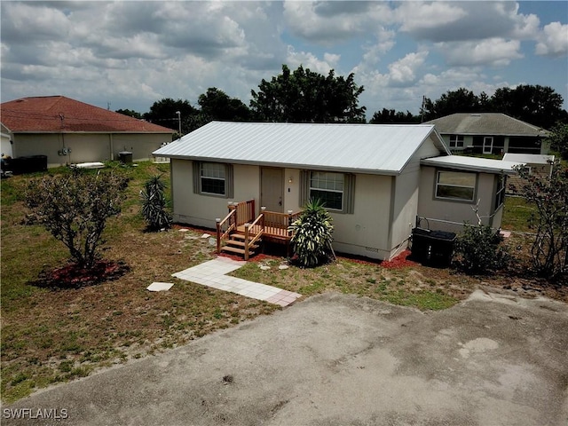3700 26th St SW, Lehigh Acres, FL 33976 - view of front of property with metal roof