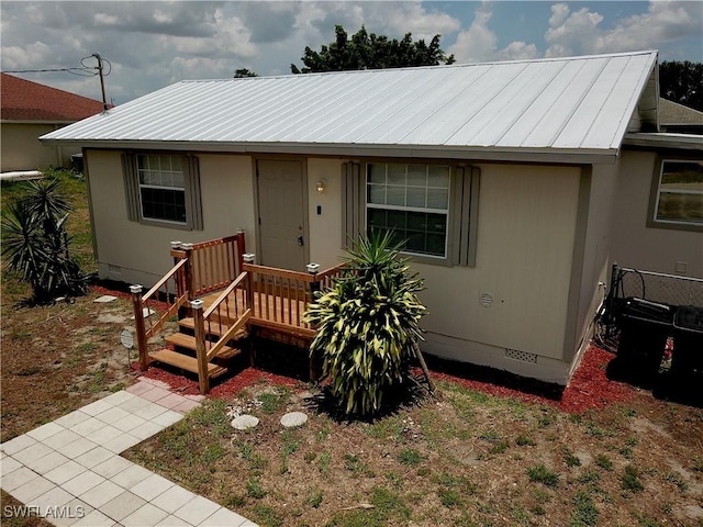 3700 26th St SW, Lehigh Acres, FL 33976 - view of front of house with crawl space and metal roof