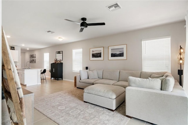 8833 Swell Brooks Ct, North Fort Myers, FL 33917 - living area with light tile patterned flooring, a ceiling fan, recessed lighting, and baseboards