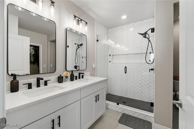 8833 Swell Brooks Ct, North Fort Myers, FL 33917 - bathroom featuring double vanity, a stall shower, tile patterned floors, recessed lighting, and toilet