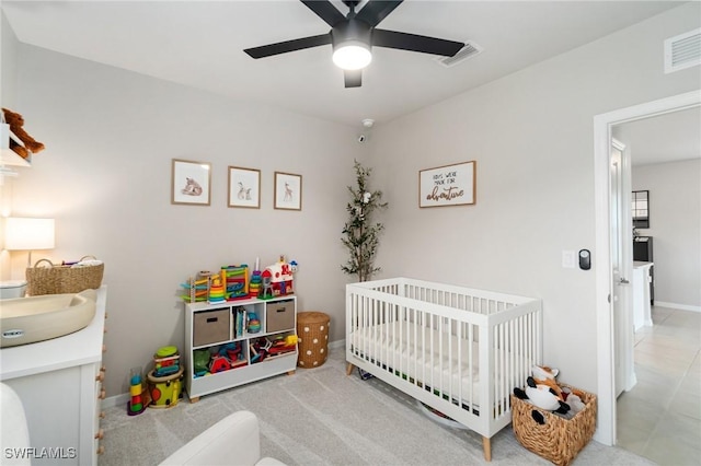 8833 Swell Brooks Ct, North Fort Myers, FL 33917 - bedroom featuring a nursery area, ceiling fan, a sink, and baseboards