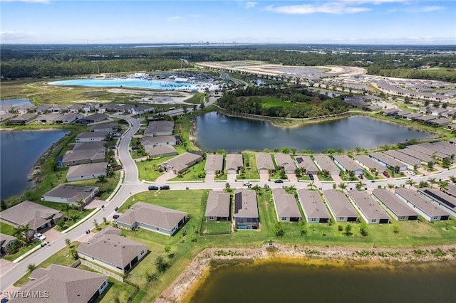 8833 Swell Brooks Ct, North Fort Myers, FL 33917 - aerial view of property and surrounding area with a nearby body of water and nearby suburban area