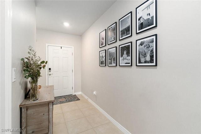 8833 Swell Brooks Ct, North Fort Myers, FL 33917 - doorway to outside featuring light tile patterned floors, baseboards, and recessed lighting