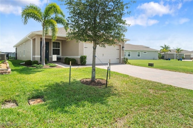 8833 Swell Brooks Ct, North Fort Myers, FL 33917 - single story home with driveway, stucco siding, an attached garage, and a front lawn