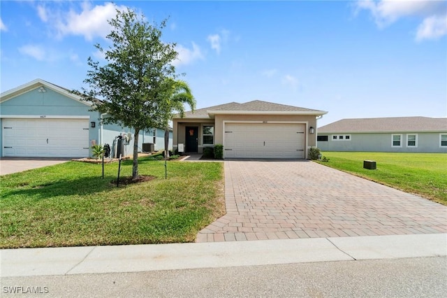 8833 Swell Brooks Ct, North Fort Myers, FL 33917 - ranch-style home featuring a garage, a front yard, driveway, stucco siding, and central air condition unit