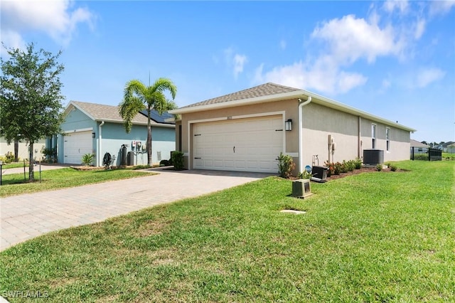 8833 Swell Brooks Ct, North Fort Myers, FL 33917 - view of front facade featuring cooling unit, stucco siding, driveway, an attached garage, and a front yard