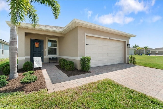 8833 Swell Brooks Ct, North Fort Myers, FL 33917 - single story home featuring stucco siding, a garage, decorative driveway, and a front lawn