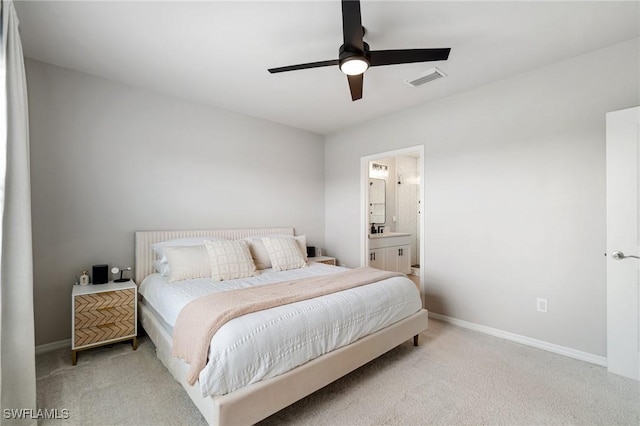 8833 Swell Brooks Ct, North Fort Myers, FL 33917 - carpeted bedroom with baseboards, ensuite bath, and a ceiling fan