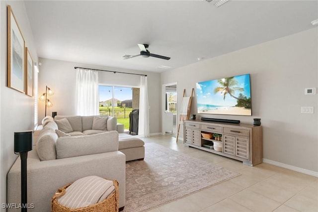 8833 Swell Brooks Ct, North Fort Myers, FL 33917 - living area with a ceiling fan, baseboards, and light tile patterned flooring