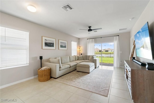 8833 Swell Brooks Ct, North Fort Myers, FL 33917 - living area with ceiling fan, light tile patterned flooring, and baseboards